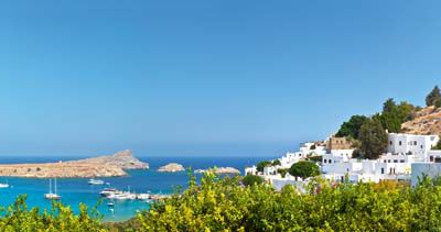 Greece. Rhodes. The picturesque sea bay and town of Lindos with